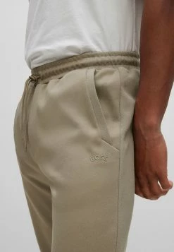 BOSS HADIKO CURVED - Tracksuit Bottoms - Light Green Four -BOSS Sales Store 4334bc2d6596421cb4af49235b01a2a7