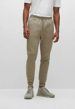 BOSS HADIKO CURVED - Tracksuit Bottoms - Light Green Four